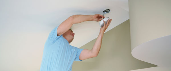 Electrician Installing a Smoke Detector